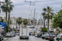 view from the street to pasalimani in piraeus with many boats and yachts at the harbor