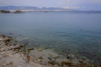 a woman at the beach of piraeus near the olympiacos FC headquarter