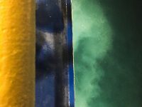 at the top is a yello and blue shiprailing and below the turquiose sea, on the way to rhodes